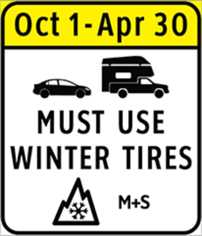 BC highway regulatory sign requiring winter tires from October 1 to April 30, showing the M+S and 3-peak mountain snowflake symbols