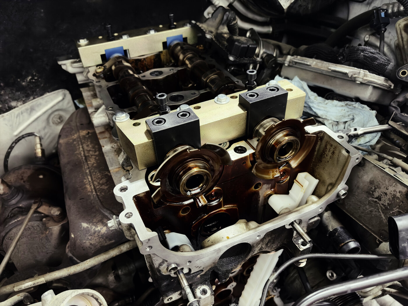 Sludge and oil coking inside a Mercedes Metris timing chain cover from neglected oil changes