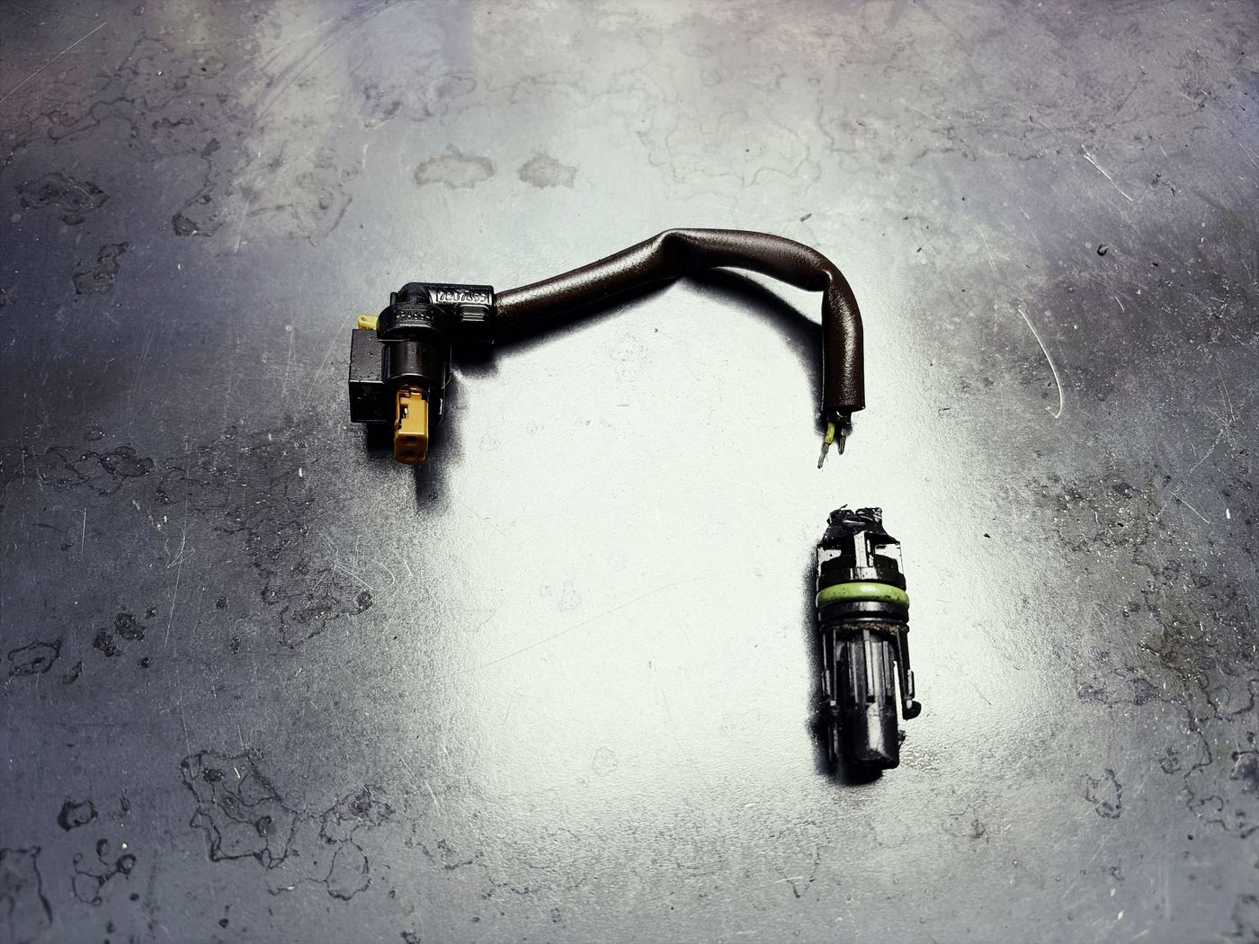 Corroded and damaged oil pump control valve wiring harness connector removed from a Mercedes M274 engine