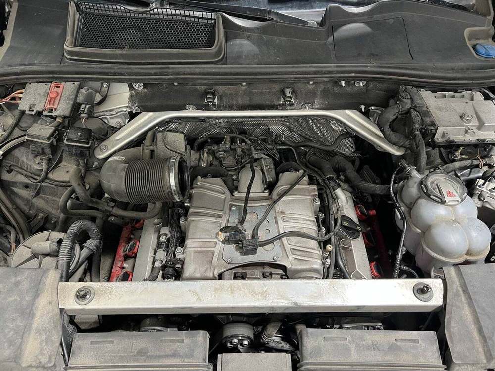 Audi Q7 engine bay with intake components removed for PCV system inspection