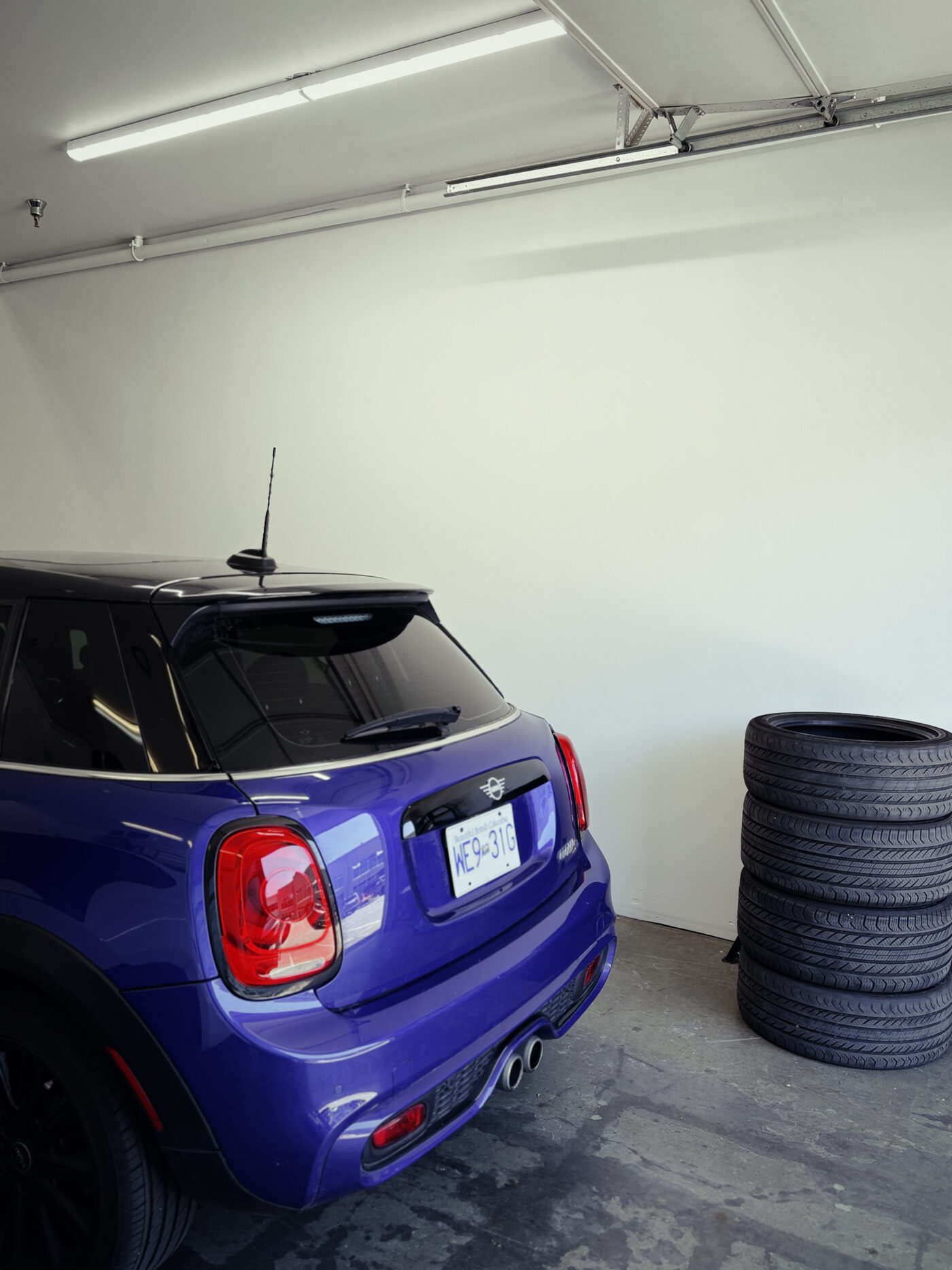 Technician inspecting a MINI undercarriage
